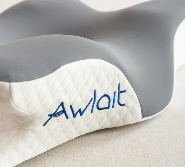 Ergonomic cervical pillow supporting neck curve to reduce stiffness and improve sleep quality